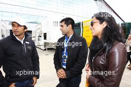 (L to R): Narain Karthikeyan (IND) Hispania Racing F1 Team (HRT) with Karun Chandhok (IND) and his girlfriend. 08.07.2012. Formula 1 World Championship, Rd 9, British Grand Prix, Silverstone, England, Race Day