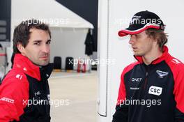 (L to R): Timo Glock (GER) Marussia F1 Team with Charles Pic (FRA) Marussia F1 Team. 08.07.2012. Formula 1 World Championship, Rd 9, British Grand Prix, Silverstone, England, Race Day
