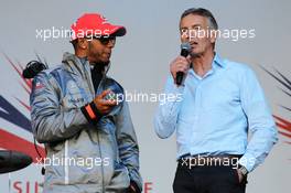 (L to R): Lewis Hamilton (GBR) McLaren with Tony Jardine (GBR) at the post race concert. 08.07.2012. Formula 1 World Championship, Rd 9, British Grand Prix, Silverstone, England, Race Day