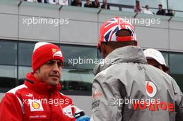 (L to R): Fernando Alonso (ESP) Ferrari and Lewis Hamilton (GBR) McLaren on the drivers parade. 08.07.2012. Formula 1 World Championship, Rd 9, British Grand Prix, Silverstone, England, Race Day