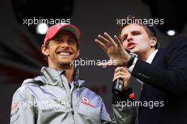 (L to R): Jenson Button (GBR) McLaren with Jake Humphrey (GBR) BBC Television Presenter at the post race concert. 08.07.2012. Formula 1 World Championship, Rd 9, British Grand Prix, Silverstone, England, Race Day