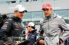 (L to R): Nico Rosberg (GER) Mercedes AMG F1 and Jenson Button (GBR) McLaren on the drivers parade. 08.07.2012. Formula 1 World Championship, Rd 9, British Grand Prix, Silverstone, England, Race Day