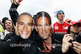 (L to R): Lewis Hamilton (GBR) McLaren and Jenson Button (GBR) McLaren fans at the post race concert. 08.07.2012. Formula 1 World Championship, Rd 9, British Grand Prix, Silverstone, England, Race Day