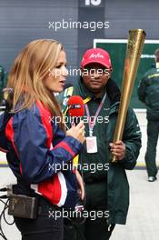 Natalie Pinkham (GBR) Sky Sports Pitlane Reporter with Tony Fernandes (MAL) Caterham Team Principal. 08.07.2012. Formula 1 World Championship, Rd 9, British Grand Prix, Silverstone, England, Race Day