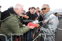 Lewis Hamilton (GBR) McLaren signs autographs for the fans at the post race concert. 08.07.2012. Formula 1 World Championship, Rd 9, British Grand Prix, Silverstone, England, Race Day
