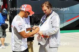 Lewis Hamilton (GBR) McLaren signs autographs for the fans. 05.07.2012. Formula 1 World Championship, Rd 9, British Grand Prix, Silverstone, England, Preparation Day