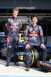 (L to R): Sebastian Vettel (GER) Red Bull Racing and Mark Webber (AUS) Red Bull Racing with the Red Bull Racing RB8 with livery made up of 1000s images of fans. 05.07.2012. Formula 1 World Championship, Rd 9, British Grand Prix, Silverstone, England, Preparation Day