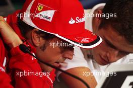 (L to R): Fernando Alonso (ESP) Ferrari with Paul di Resta (GBR) Sahara Force India F1 in the FIA Press Conference. 05.07.2012. Formula 1 World Championship, Rd 9, British Grand Prix, Silverstone, England, Preparation Day