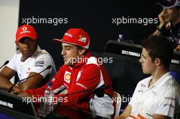 (L to R): Lewis Hamilton (GBR) McLaren; Fernando Alonso (ESP) Ferrari and Paul di Resta (GBR) Sahara Force India F1 in the FIA Press Conference. 05.07.2012. Formula 1 World Championship, Rd 9, British Grand Prix, Silverstone, England, Preparation Day