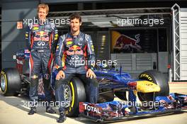 (L to R): Sebastian Vettel (GER) Red Bull Racing and Mark Webber (AUS) Red Bull Racing with the Red Bull Racing RB8 with livery made up of 1000s images of fans. 05.07.2012. Formula 1 World Championship, Rd 9, British Grand Prix, Silverstone, England, Preparation Day