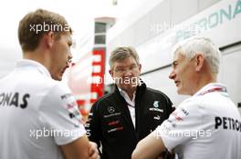 Ross Brawn (GBR) Mercedes AMG F1 Team Principal (Centre) and Geoff Willis (GBR) Hispania Racing F1 Team (HRT) Technology Director (Right). 05.07.2012. Formula 1 World Championship, Rd 9, British Grand Prix, Silverstone, England, Preparation Day