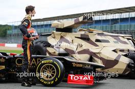 Romain Grosjean (FRA) Lotus F1 E20 with the Tumbler vehicle from the Batman movie The Dark Night Rises. 05.07.2012. Formula 1 World Championship, Rd 9, British Grand Prix, Silverstone, England, Preparation Day