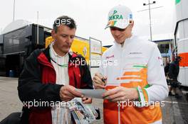 Nico Hulkenberg (GER) Sahara Force India F1 signs autographs for the fans. 20.07.2012. Formula 1 World Championship, Rd 10, German Grand Prix, Hockenheim, Germany, Practice Day
