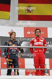 The podium (L to R):  Sebastian Vettel (GER) Red Bull Racing, second; Fernando Alonso (ESP) Ferrari, race winner. 22.07.2012. Formula 1 World Championship, Rd 10, German Grand Prix, Hockenheim, Germany, Race Day