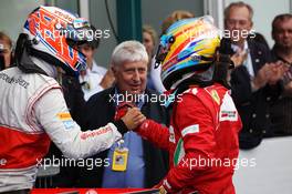 Race winner Fernando Alonso (ESP) Ferrari celebrates in parc ferme with Jenson Button (GBR) McLaren. 22.07.2012. Formula 1 World Championship, Rd 10, German Grand Prix, Hockenheim, Germany, Race Day
