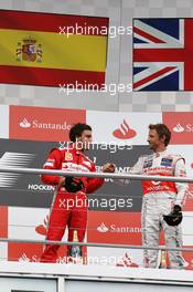 The podium (L to R): Race winner Fernando Alonso (ESP) Ferrari celebrates with third placed Jenson Button (GBR) McLaren. 22.07.2012. Formula 1 World Championship, Rd 10, German Grand Prix, Hockenheim, Germany, Race Day