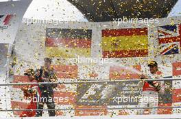 Sebastian Vettel (GER) Red Bull Racing and Jenson Button (GBR) McLaren celebrate on the podium. 22.07.2012. Formula 1 World Championship, Rd 10, German Grand Prix, Hockenheim, Germany, Race Day
