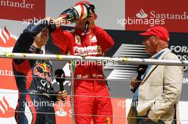 The podium (L to R): second placed Sebastian Vettel (GER) Red Bull Racing with race winner Fernando Alonso (ESP) Ferrari and Niki Lauda (AUT). 22.07.2012. Formula 1 World Championship, Rd 10, German Grand Prix, Hockenheim, Germany, Race Day