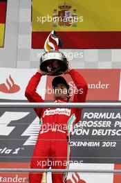 Race winner Fernando Alonso (ESP) Ferrari celebrates on the podium. 22.07.2012. Formula 1 World Championship, Rd 10, German Grand Prix, Hockenheim, Germany, Race Day