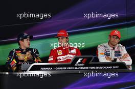 The FIA Press Conference (L to R):  Sebastian Vettel (GER) Red Bull Racing, second; Fernando Alonso (ESP) Ferrari, race winner; Jenson Button (GBR) McLaren, third. 22.07.2012. Formula 1 World Championship, Rd 10, German Grand Prix, Hockenheim, Germany, Race Day