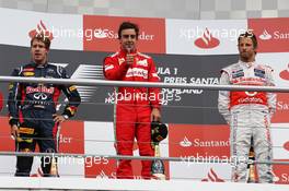 The podium (L to R):  Sebastian Vettel (GER) Red Bull Racing, second; Fernando Alonso (ESP) Ferrari, race winner; Jenson Button (GBR) McLaren, third. 22.07.2012. Formula 1 World Championship, Rd 10, German Grand Prix, Hockenheim, Germany, Race Day