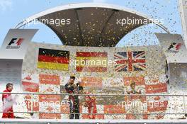 The podium (L to R):  Sebastian Vettel (GER) Red Bull Racing, second; Fernando Alonso (ESP) Ferrari, race winner; Jenson Button (GBR) McLaren, third.  22.07.2012. Formula 1 World Championship, Rd 10, German Grand Prix, Hockenheim, Germany, Race Day