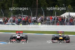 Sebastian Vettel (GER), Red Bull Racing overtakes Jenson Button (GBR), McLaren Mercedes  22.07.2012. Formula 1 World Championship, Rd 10, German Grand Prix, Hockenheim, Germany, Race Day
