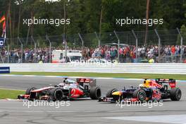 Sebastian Vettel (GER), Red Bull Racing overtakes Jenson Button (GBR), McLaren Mercedes  22.07.2012. Formula 1 World Championship, Rd 10, German Grand Prix, Hockenheim, Germany, Race Day