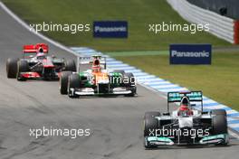 Michael Schumacher (GER), Mercedes GP  leads Nico Hulkenberg (GER), Sahara Force India Formula One Team  22.07.2012. Formula 1 World Championship, Rd 10, German Grand Prix, Hockenheim, Germany, Race Day
