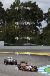 Pedro De La Rosa (ESP) HRT Formula 1 Team F112 leads Kamui Kobayashi (JPN) Sauber C31. 22.07.2012. Formula 1 World Championship, Rd 10, German Grand Prix, Hockenheim, Germany, Race Day