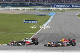 Lewis Hamilton (GBR) McLaren MP4/27 unlaps himself from Sebastian Vettel (GER) Red Bull Racing RB8. 22.07.2012. Formula 1 World Championship, Rd 10, German Grand Prix, Hockenheim, Germany, Race Day