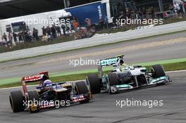 Daniel Ricciardo (AUS) Scuderia Toro Rosso STR7 and Nico Rosberg (GER) Mercedes AMG F1 W03 battle for position. 22.07.2012. Formula 1 World Championship, Rd 10, German Grand Prix, Hockenheim, Germany, Race Day