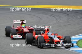 Timo Glock (GER) Marussia F1 Team MR01 leads Felipe Massa (BRA) Ferrari F2012. 22.07.2012. Formula 1 World Championship, Rd 10, German Grand Prix, Hockenheim, Germany, Race Day