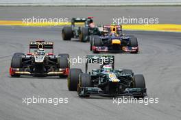Vitaly Petrov (RUS) Caterham CT01 leads Kimi Raikkonen (FIN) Lotus F1 E20. 22.07.2012. Formula 1 World Championship, Rd 10, German Grand Prix, Hockenheim, Germany, Race Day