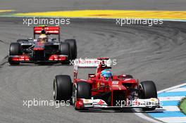 Fernando Alonso (ESP) Ferrari F2012 leads a lapped Lewis Hamilton (GBR) McLaren MP4/27. 22.07.2012. Formula 1 World Championship, Rd 10, German Grand Prix, Hockenheim, Germany, Race Day