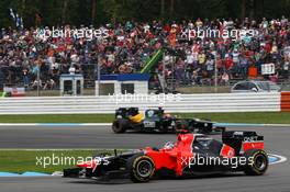Timo Glock (GER) Marussia F1 Team MR01 leads Heikki Kovalainen (FIN) Caterham CT01. 21.07.2012. Formula 1 World Championship, Rd 10, German Grand Prix, Hockenheim, Germany, Qualifying Day