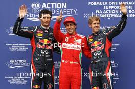 Qualifying parc ferme (L to R): Mark Webber (AUS) Red Bull Racing, third; Fernando Alonso (ESP) Ferrari, pole position; Sebastian Vettel (GER) Red Bull Racing, third. 21.07.2012. Formula 1 World Championship, Rd 10, German Grand Prix, Hockenheim, Germany, Qualifying Day