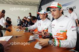 (L to R): Paul di Resta (GBR) Sahara Force India F1; Nico Hulkenberg (GER) Sahara Force India F1 and Jules Bianchi (FRA) Sahara Force India F1 Team Third Driver sign autographs for the fans. 21.07.2012. Formula 1 World Championship, Rd 10, German Grand Prix, Hockenheim, Germany, Qualifying Day