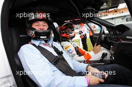 Jules Bianchi (FRA) Sahara Force India F1 Team Third Driver gives a taxi ride to Byron Young (GBR) Journalist around the circuit. 21.07.2012. Formula 1 World Championship, Rd 10, German Grand Prix, Hockenheim, Germany, Qualifying Day