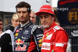 (L to R): third placed Mark Webber (AUS) Red Bull Racing and pole sitter Fernando Alonso (ESP) Ferrari in parc ferme. 21.07.2012. Formula 1 World Championship, Rd 10, German Grand Prix, Hockenheim, Germany, Qualifying Day