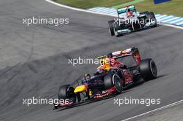 Mark Webber (AUS) Red Bull Racing RB8 leads Michael Schumacher (GER) Mercedes AMG F1 W03. 21.07.2012. Formula 1 World Championship, Rd 10, German Grand Prix, Hockenheim, Germany, Qualifying Day