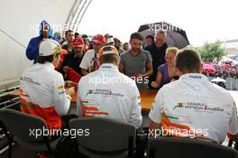 (L to R): Jules Bianchi (FRA) Sahara Force India F1 Team Third Driver; Nico Hulkenberg (GER) Sahara Force India F1; and Paul di Resta (GBR) Sahara Force India F1 sign autographs for the fans. 21.07.2012. Formula 1 World Championship, Rd 10, German Grand Prix, Hockenheim, Germany, Qualifying Day