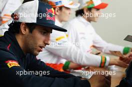 Daniel Ricciardo (AUS) Scuderia Toro Rosso signs autographs for the fans. 21.07.2012. Formula 1 World Championship, Rd 10, German Grand Prix, Hockenheim, Germany, Qualifying Day