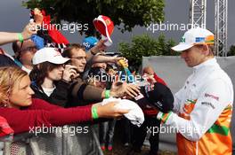 Nico Hulkenberg (GER) Sahara Force India F1 signs autographs for the fans. 21.07.2012. Formula 1 World Championship, Rd 10, German Grand Prix, Hockenheim, Germany, Qualifying Day