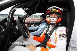 Jules Bianchi (FRA) Sahara Force India F1 Team Third Driver gives a taxi ride to Byron Young (GBR) Journalist around the circuit. 21.07.2012. Formula 1 World Championship, Rd 10, German Grand Prix, Hockenheim, Germany, Qualifying Day