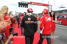 (L to R): Lewis Hamilton (GBR) McLaren with Fernando Alonso (ESP) Ferrari on the drivers parade. 22.07.2012. Formula 1 World Championship, Rd 10, German Grand Prix, Hockenheim, Germany, Race Day