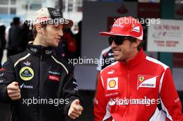 (L to R): Romain Grosjean (FRA) Lotus F1 Team with Fernando Alonso (ESP) Ferrari on the drivers parade. 22.07.2012. Formula 1 World Championship, Rd 10, German Grand Prix, Hockenheim, Germany, Race Day