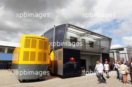 Red Bull Racing Comms Unit and Renault F1 Sport Truck with some dark clouds hanging over it. 22.07.2012. Formula 1 World Championship, Rd 10, German Grand Prix, Hockenheim, Germany, Race Day