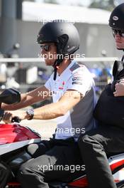 Jenson Button (GBR) McLaren arrrives at the circuit on a motorbike with Mike Collier (GBR) Personal Trainer. 22.07.2012. Formula 1 World Championship, Rd 10, German Grand Prix, Hockenheim, Germany, Race Day