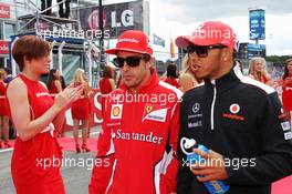 (L to R): Fernando Alonso (ESP) Ferrari with Lewis Hamilton (GBR) McLaren on the drivers parade. 22.07.2012. Formula 1 World Championship, Rd 10, German Grand Prix, Hockenheim, Germany, Race Day